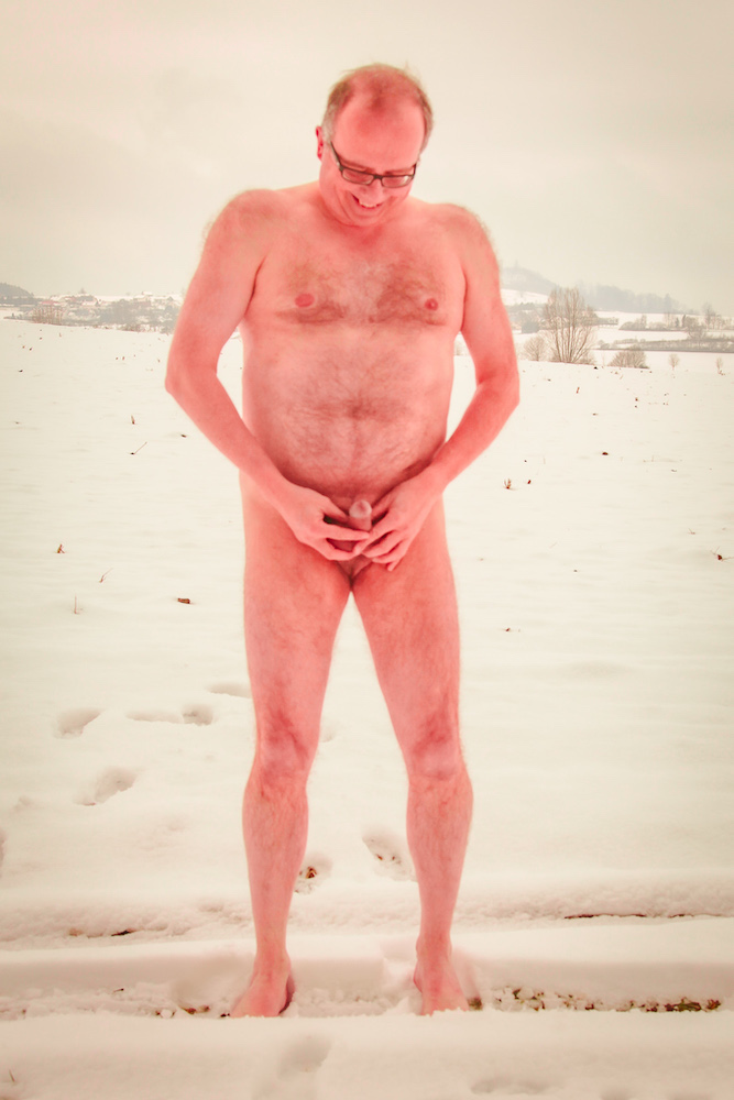 Frozen red naked skin surrounded by snowy countryside