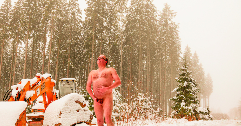 Stark naked holding my penis on a forrest road with deep January snow