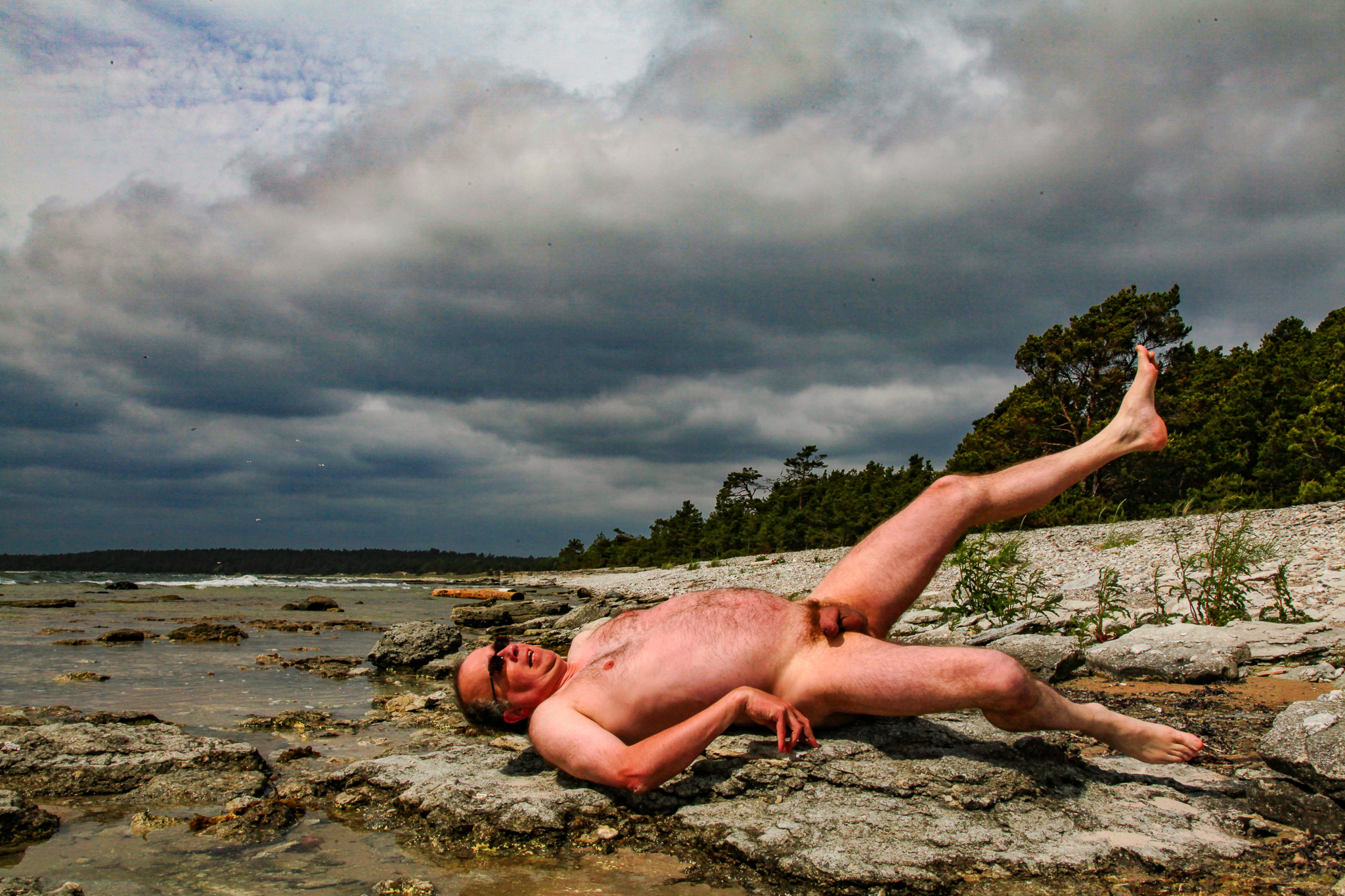 Nude man with his genitals exposed on a Gotland beach