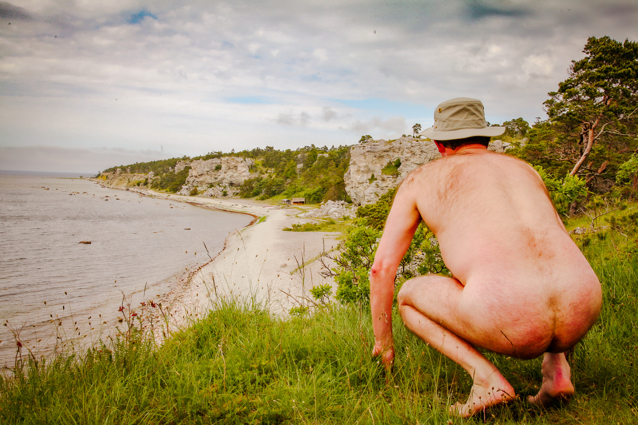 Stark naked man on Gotland showing his buttocks