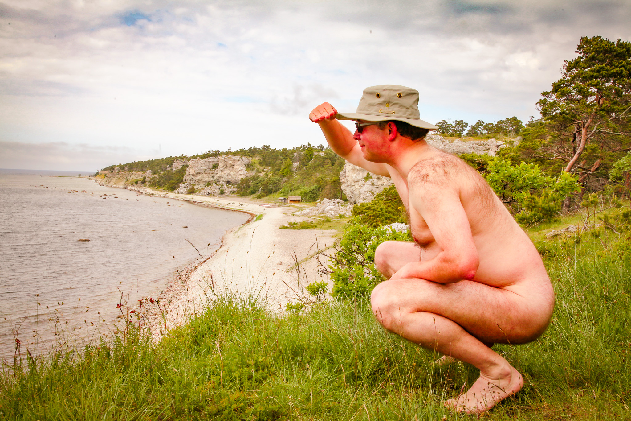 Stark naked man views from the cliffs